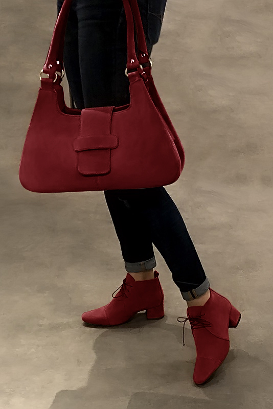 Burgundy red women's ankle boots with laces at the front. Round toe. Low flare heels. Worn view - Florence KOOIJMAN